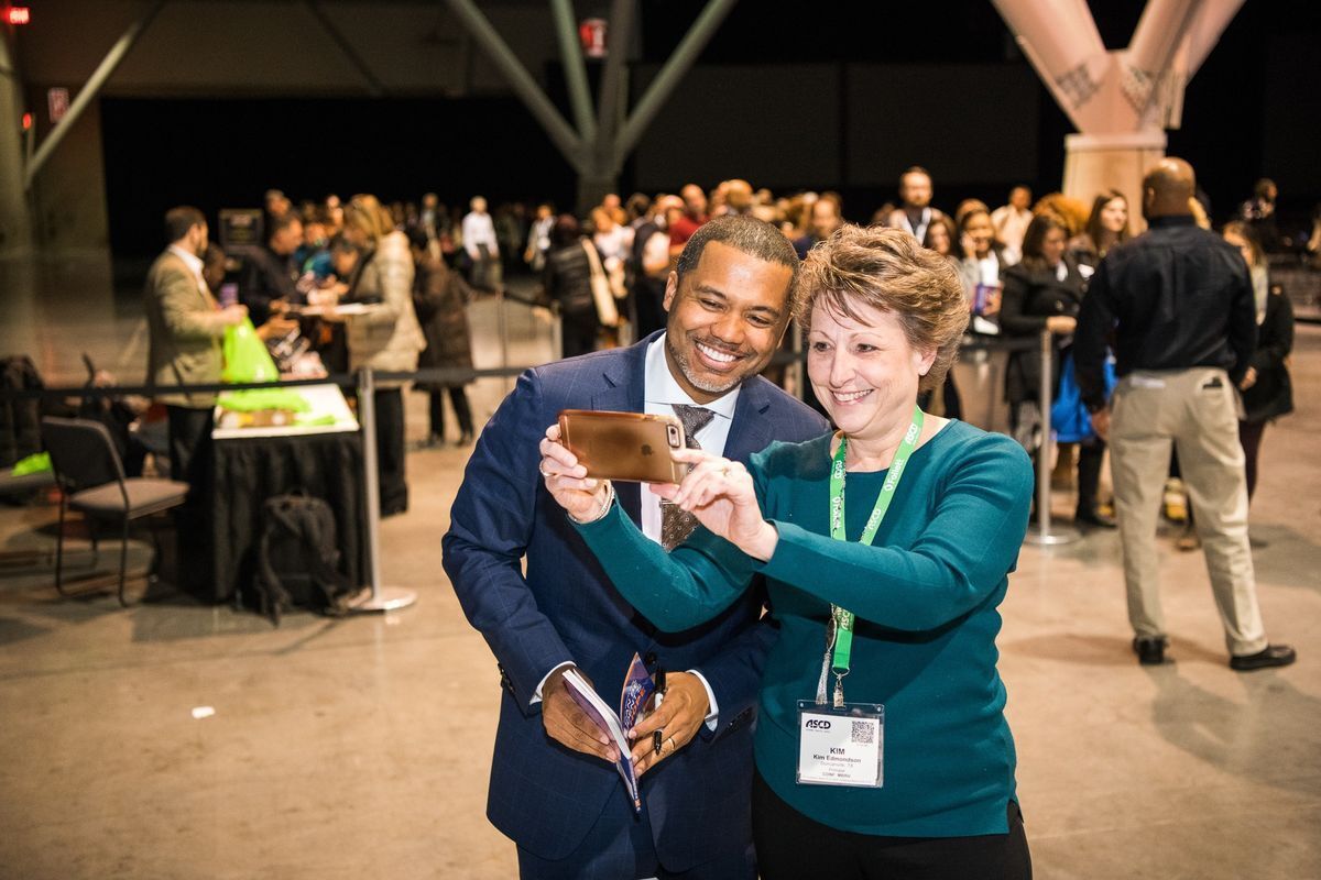 Dr. Scott with an educator at a conference